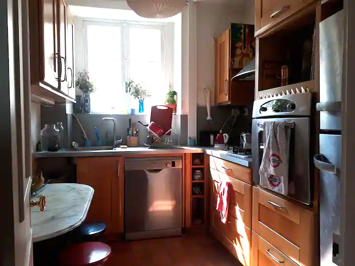 large, sunny and fully equiped kitchen shared with one person (female parisianer / creative free lance))